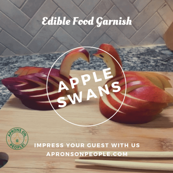 Two apple swans facing each other
