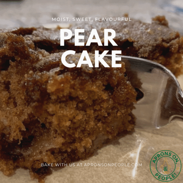 A moist piece of pear cake on a plate with a fork breaking into it