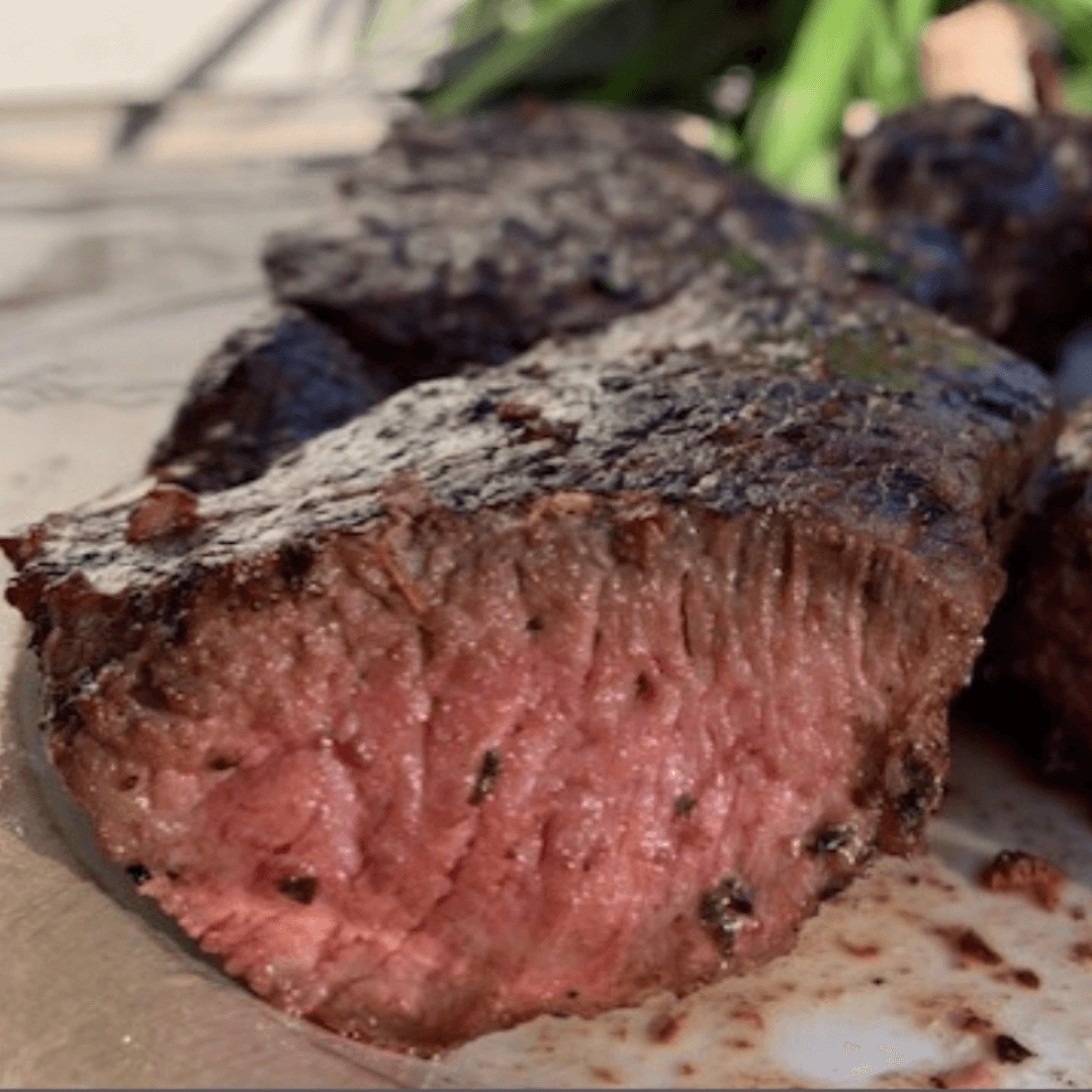 steak square compressed Cooked steak on a plate cut open and looks delicious