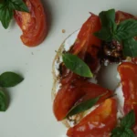 Roasted tomato and goat cheese on a bagel